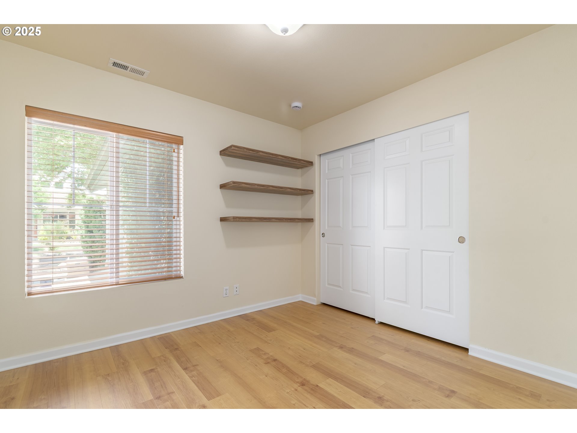 5470 Jeffrey Way Eugene, OR 97402 - Photo 21 of 48 a view of empty room with wooden floor and fan