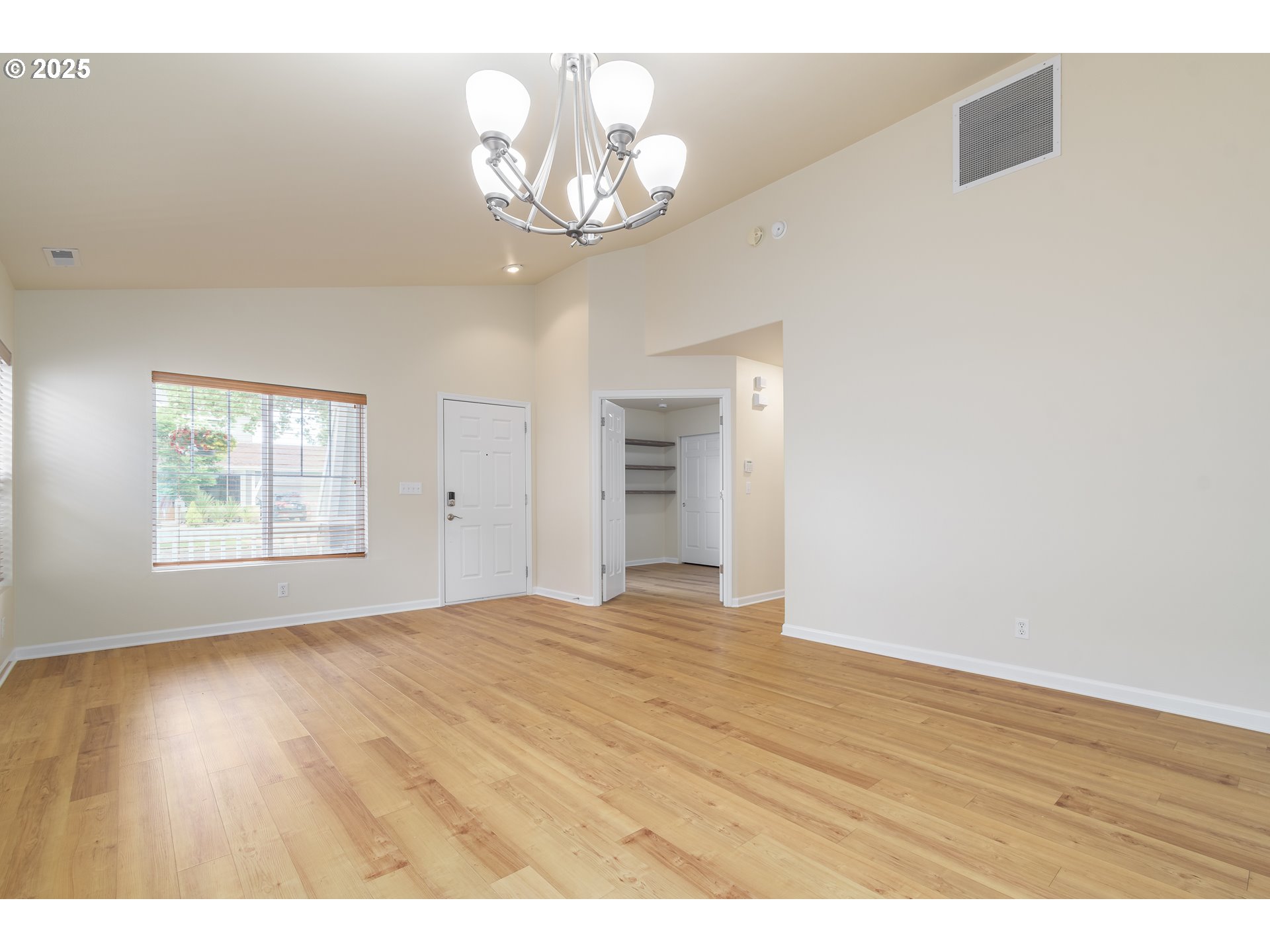 5470 Jeffrey Way Eugene, OR 97402 - Photo 7 of 48 a view of an empty room with wooden floor and a window