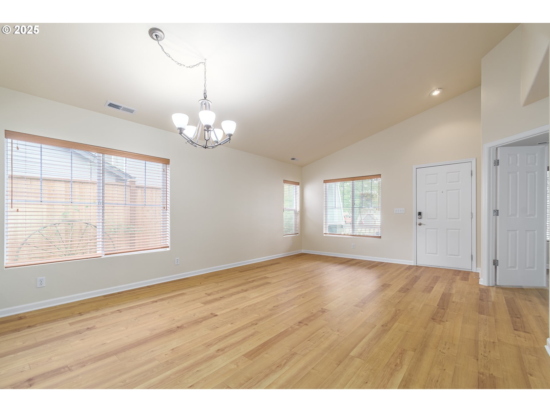 5470 Jeffrey Way Eugene, OR 97402 - Photo 8 of 48 an empty room with wooden floor and windows