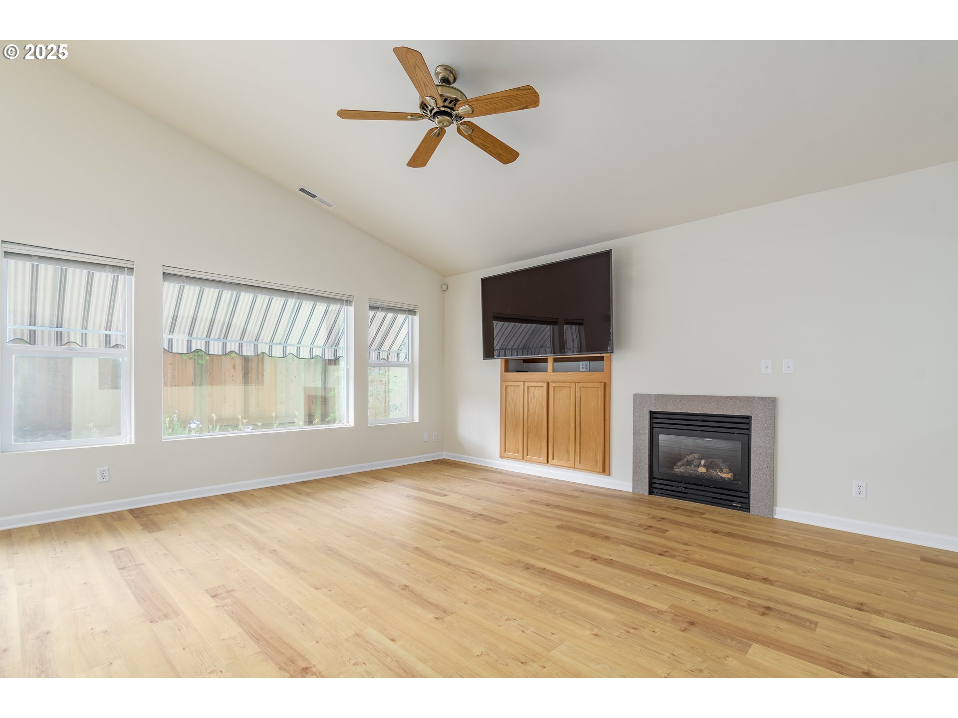 5470 Jeffrey Way Eugene, OR 97402 - Photo 10 of 48 a view of room with a ceiling fan and wooden floor