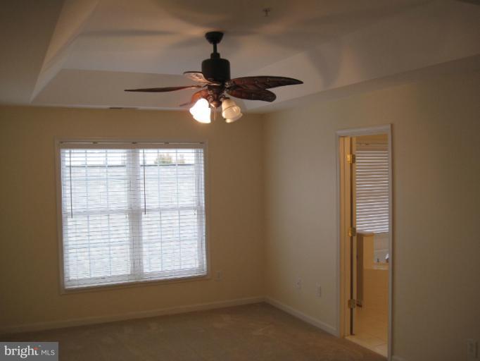 3661 Tavistock Road Frederick, MD 21704 - Photo 4 of 15 an empty room with a window and a fan