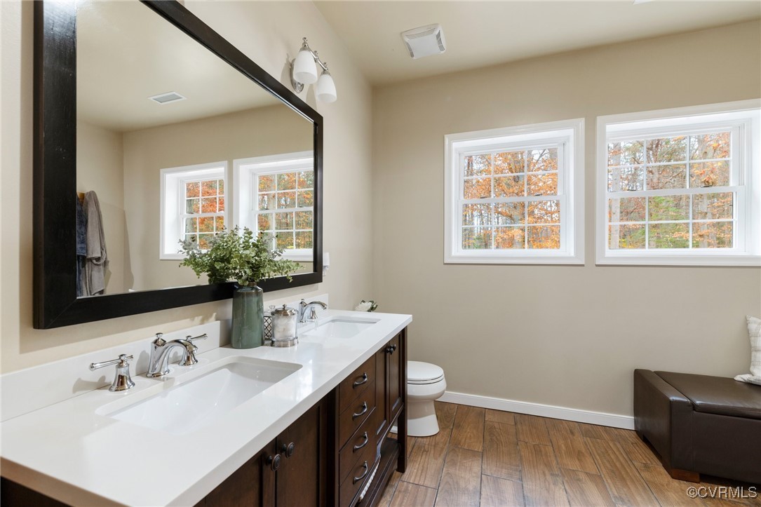 3798 Riddles Bridge Road Goochland, VA 23063 - Photo 16 of 31 a bathroom with a sink vanity granite and a toilet