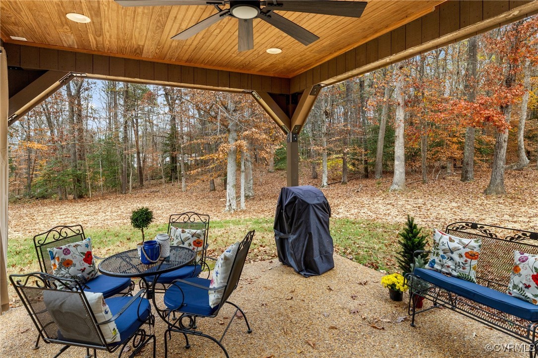 3798 Riddles Bridge Road Goochland, VA 23063 - Photo 27 of 31 a dining room with furniture and a floor to ceiling window
