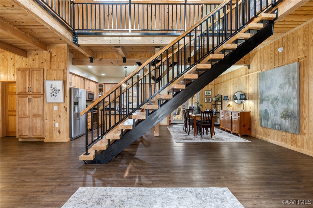 3798 Riddles Bridge Road Goochland, VA 23063 - Photo 3 of 31 a view of staircase with lots of frames on wall and wooden floor