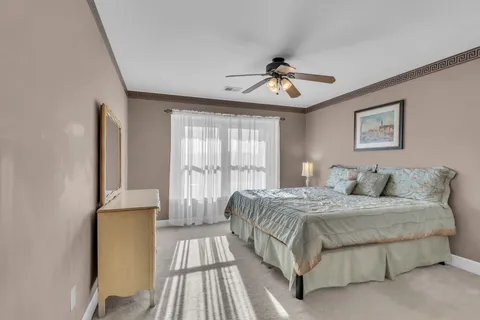 a bathroom with a sink and mirror with shower