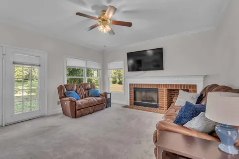 a spacious bedroom with a bed and a chandelier