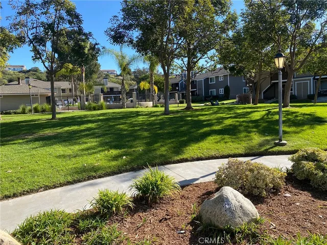 a garden view with a fountain