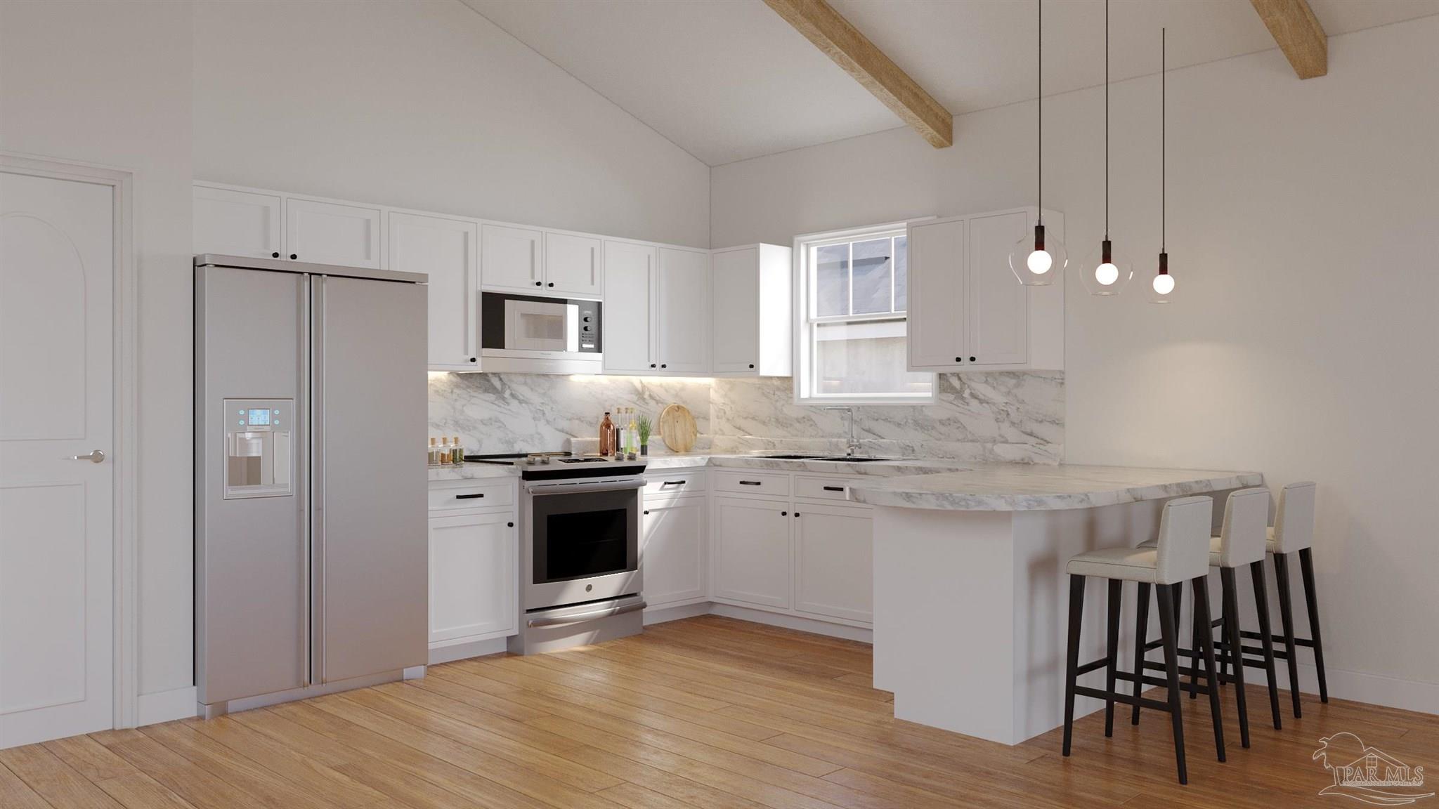 a kitchen with kitchen island granite countertop a stove top oven a sink and cabinets
