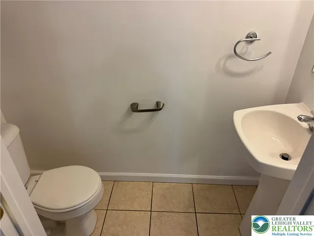 a bathroom with a toilet and a sink