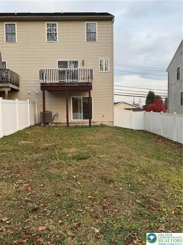 a view of a kitchen with a sink and cabinets