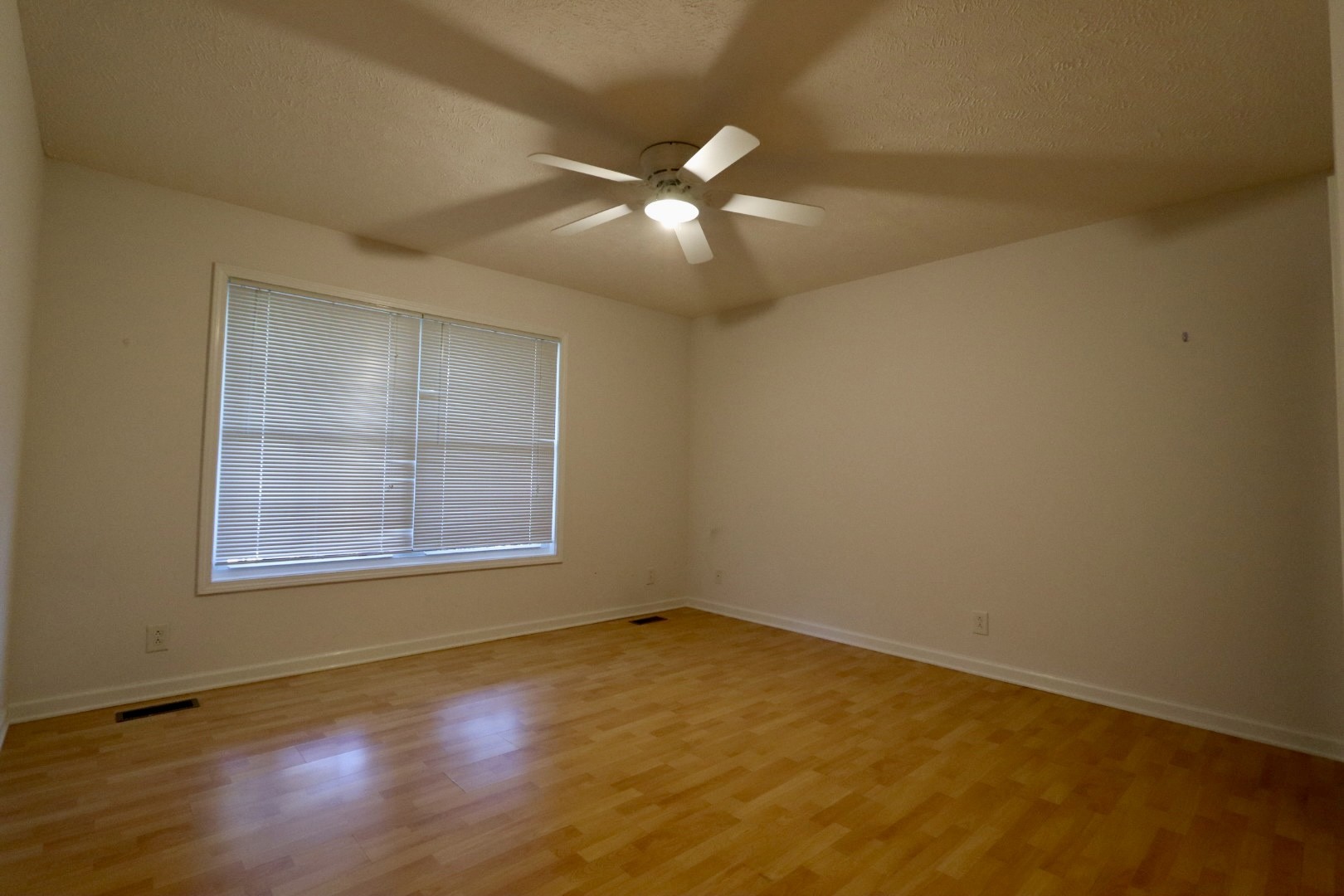 1462 Lock B Road South Clarksville, TN 37040 - Photo 12 of 25 an empty room with a window and wooden floor