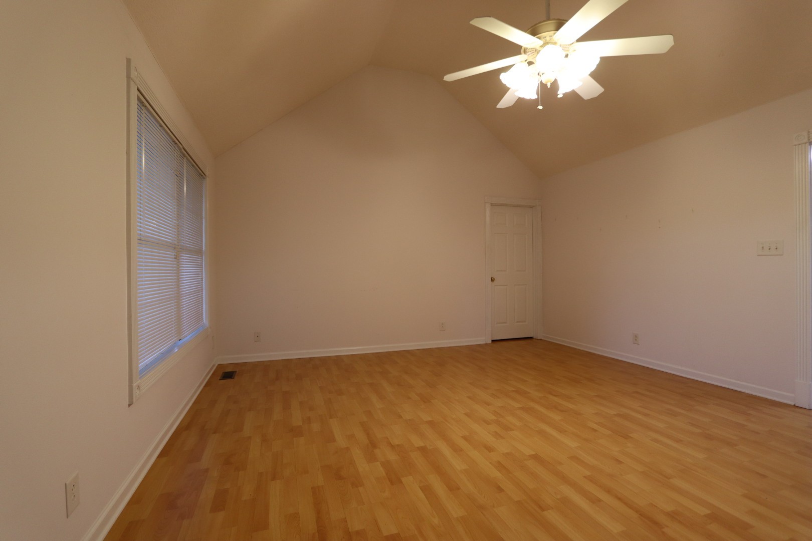 1462 Lock B Road South Clarksville, TN 37040 - Photo 4 of 25 an empty room with a chandelier fan and windows