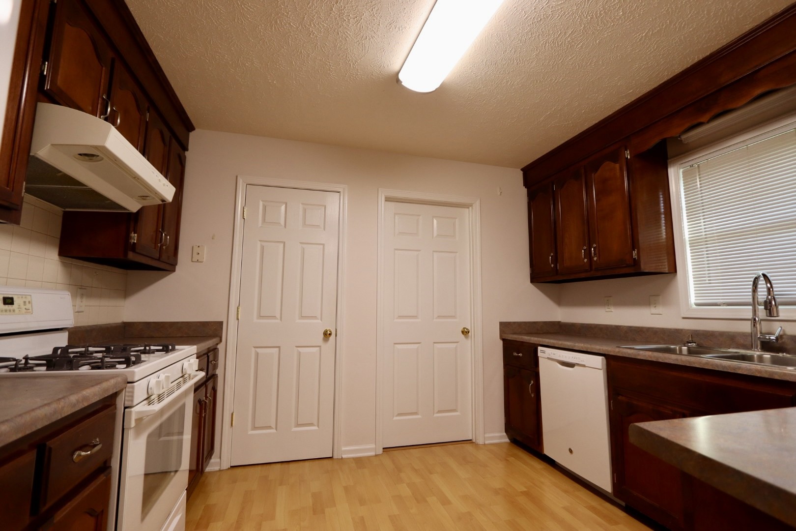 1462 Lock B Road South Clarksville, TN 37040 - Photo 5 of 25 a kitchen with stainless steel appliances granite countertop a stove a sink and a microwave