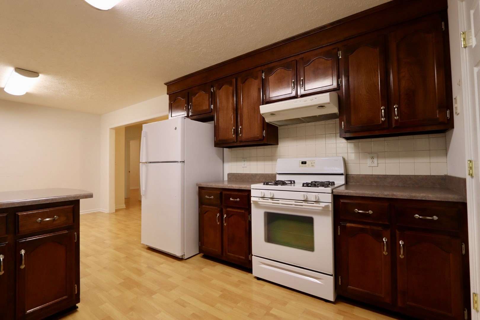 1462 Lock B Road South Clarksville, TN 37040 - Photo 7 of 25 a kitchen with a stove and a refrigerator
