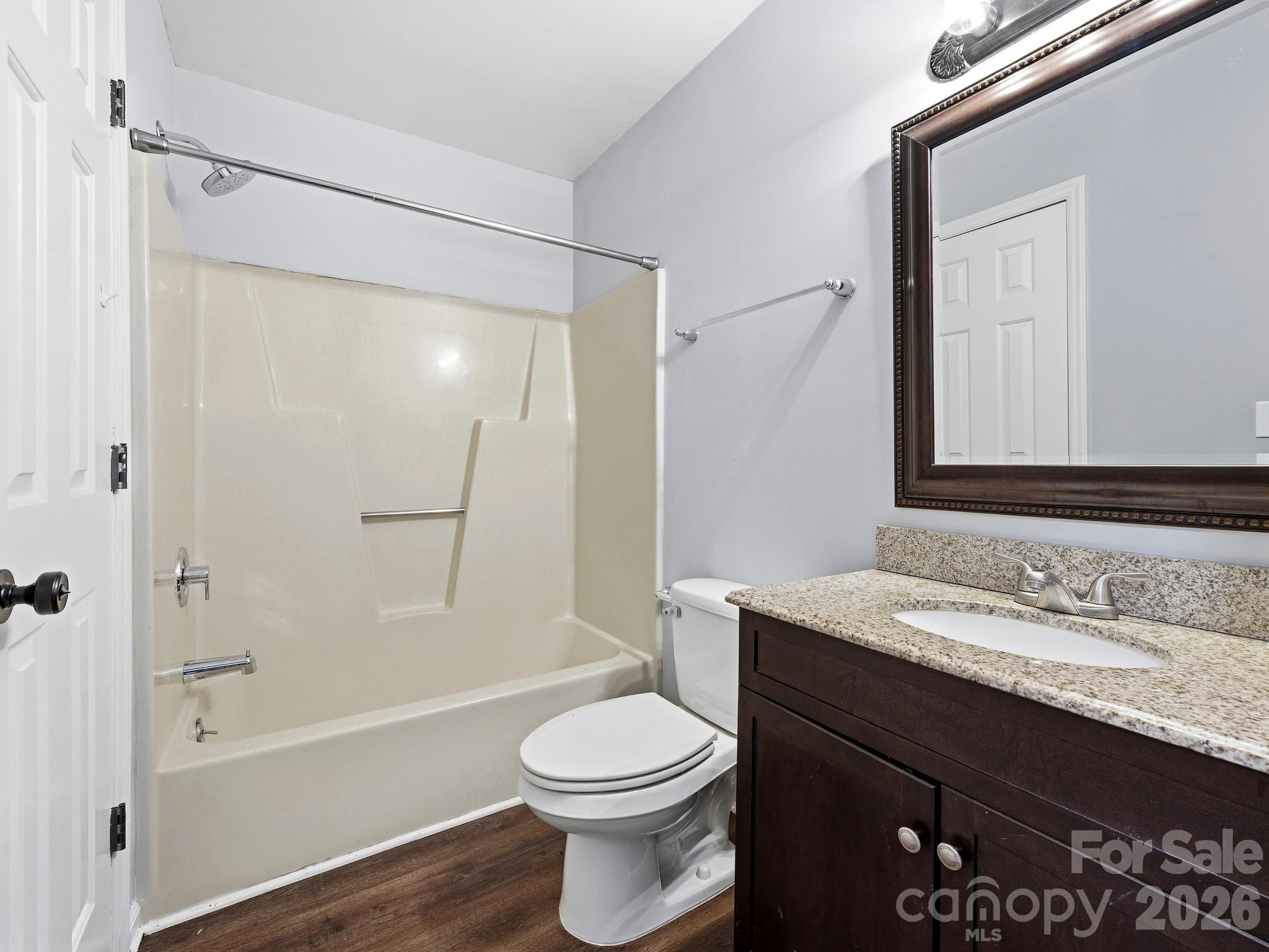 110 Heywood Road Arden, NC 28704 - Photo 16 of 22 a bathroom with a granite countertop sink toilet and shower