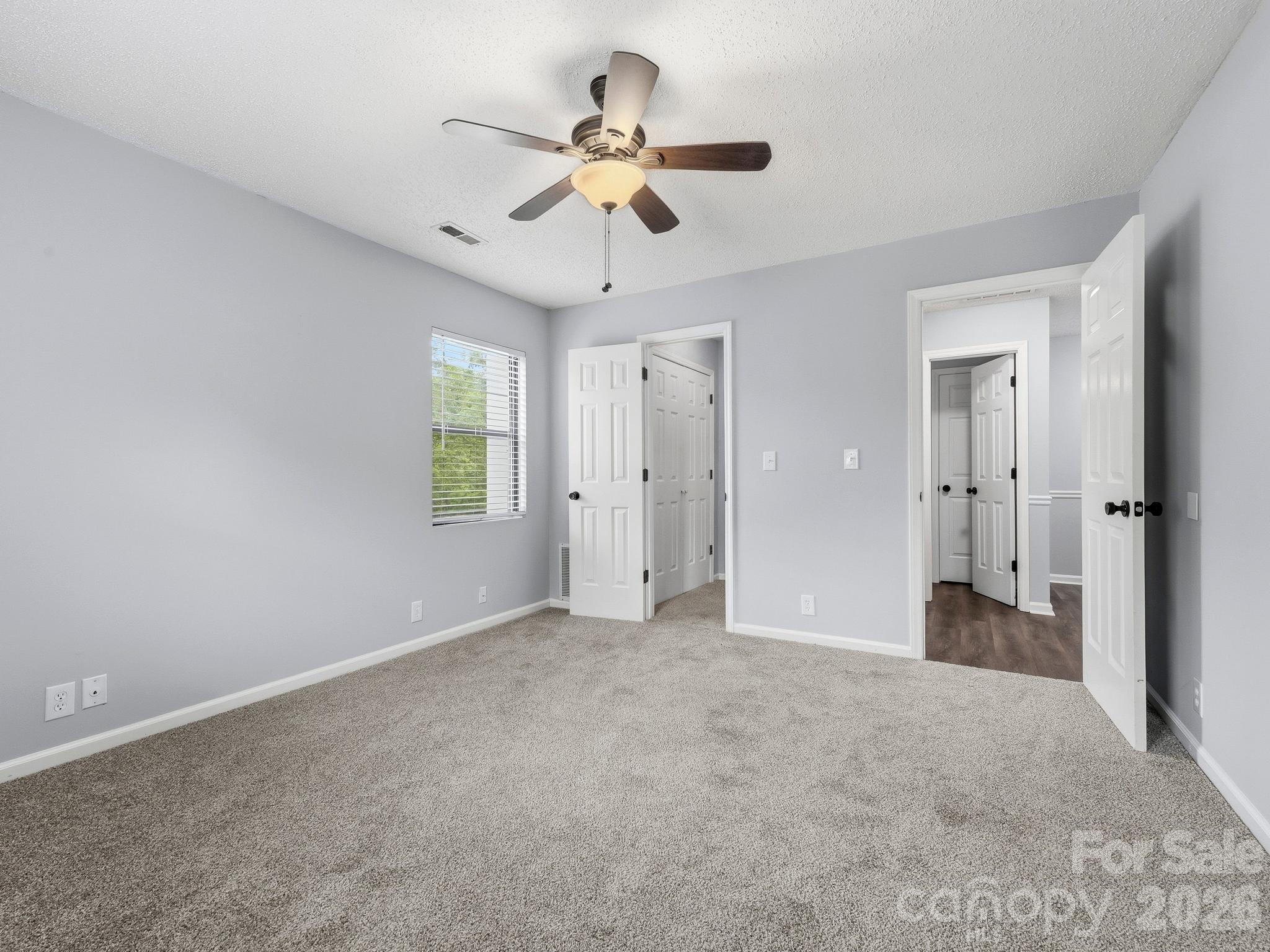 110 Heywood Road Arden, NC 28704 - Photo 17 of 22 a view of empty room with ceiling fan