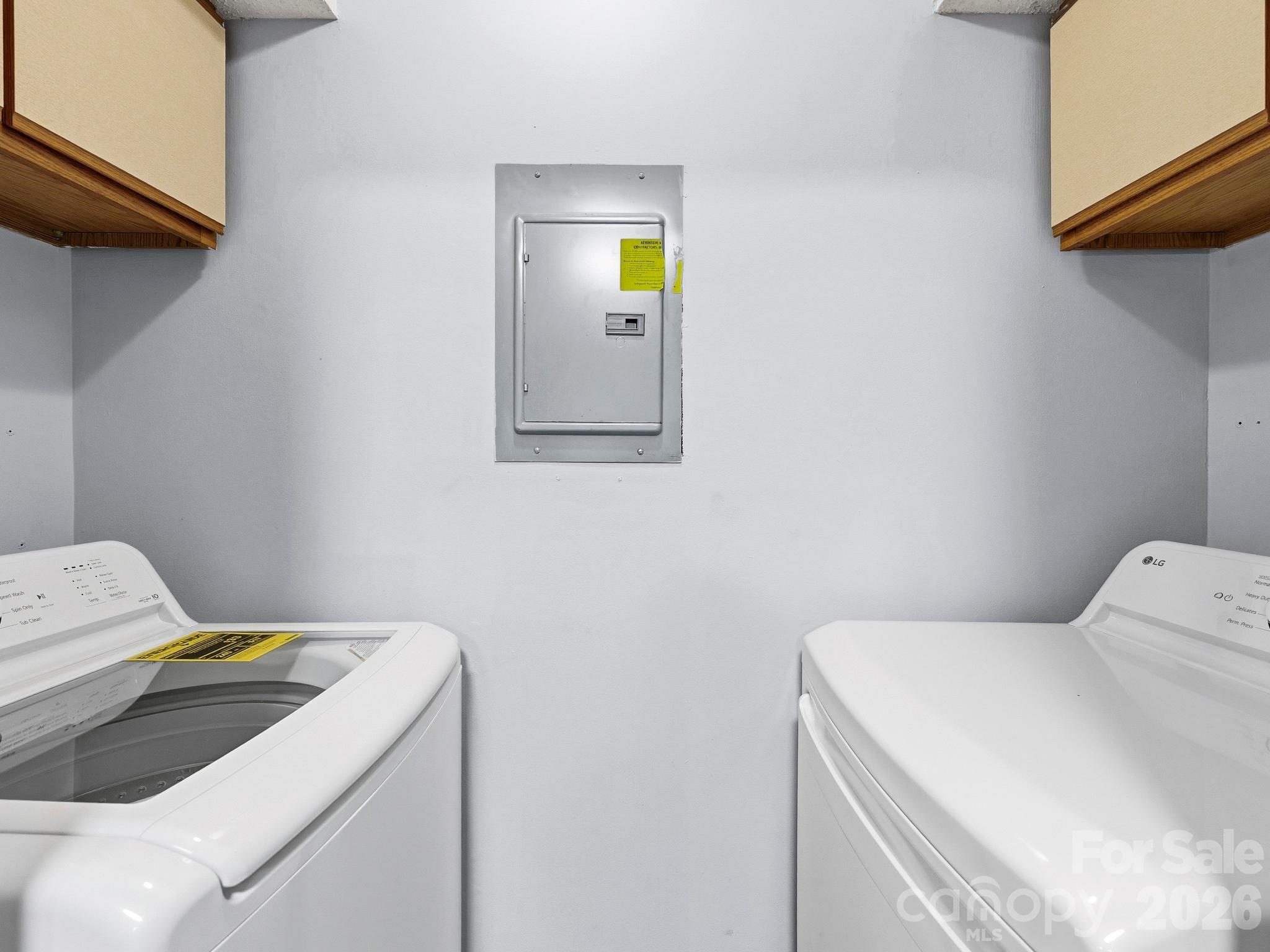 110 Heywood Road Arden, NC 28704 - Photo 18 of 22 a utility room with dryer and washer