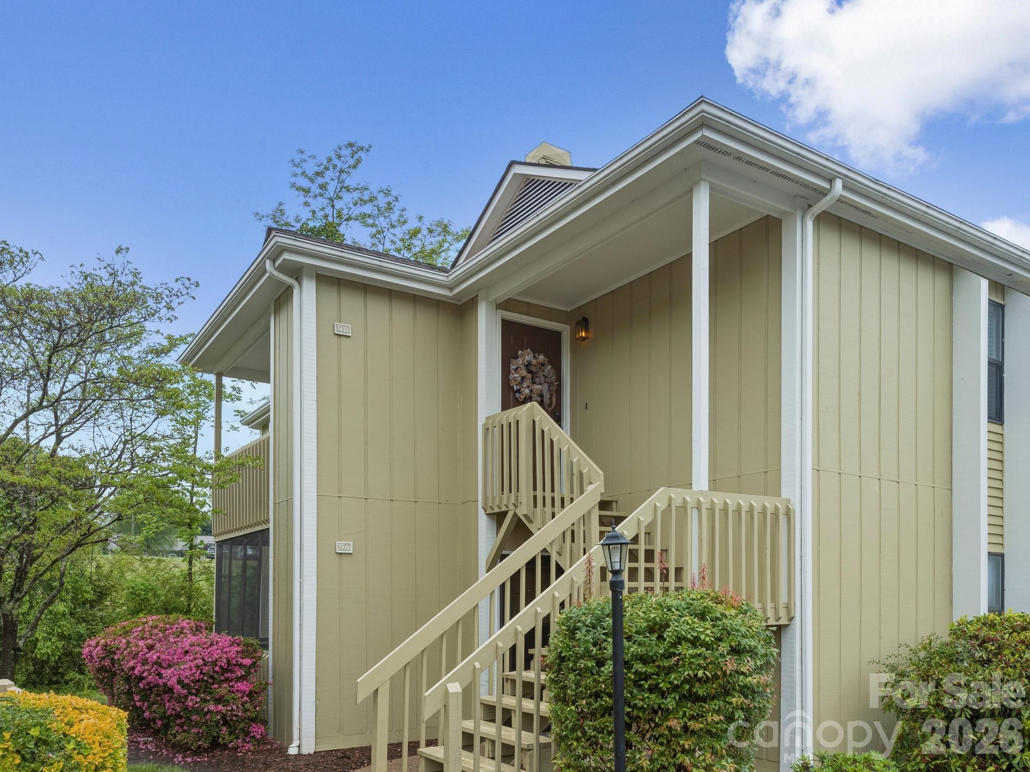 110 Heywood Road Arden, NC 28704 - Photo 2 of 22 a front view of a house with a yard