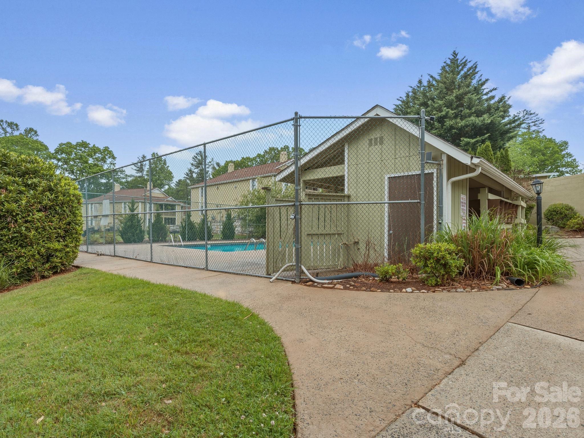 110 Heywood Road Arden, NC 28704 - Photo 21 of 22 a view of a small house with a yard