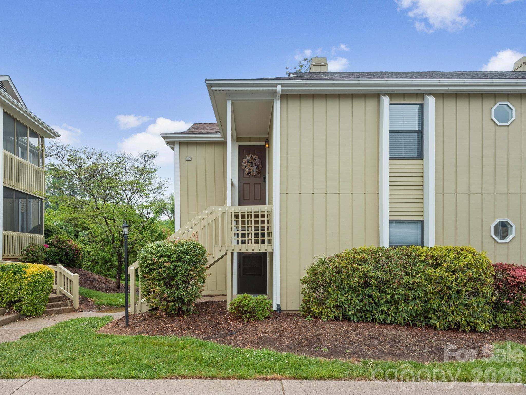 110 Heywood Road Arden, NC 28704 - Photo 22 of 22 a view of a house with a yard