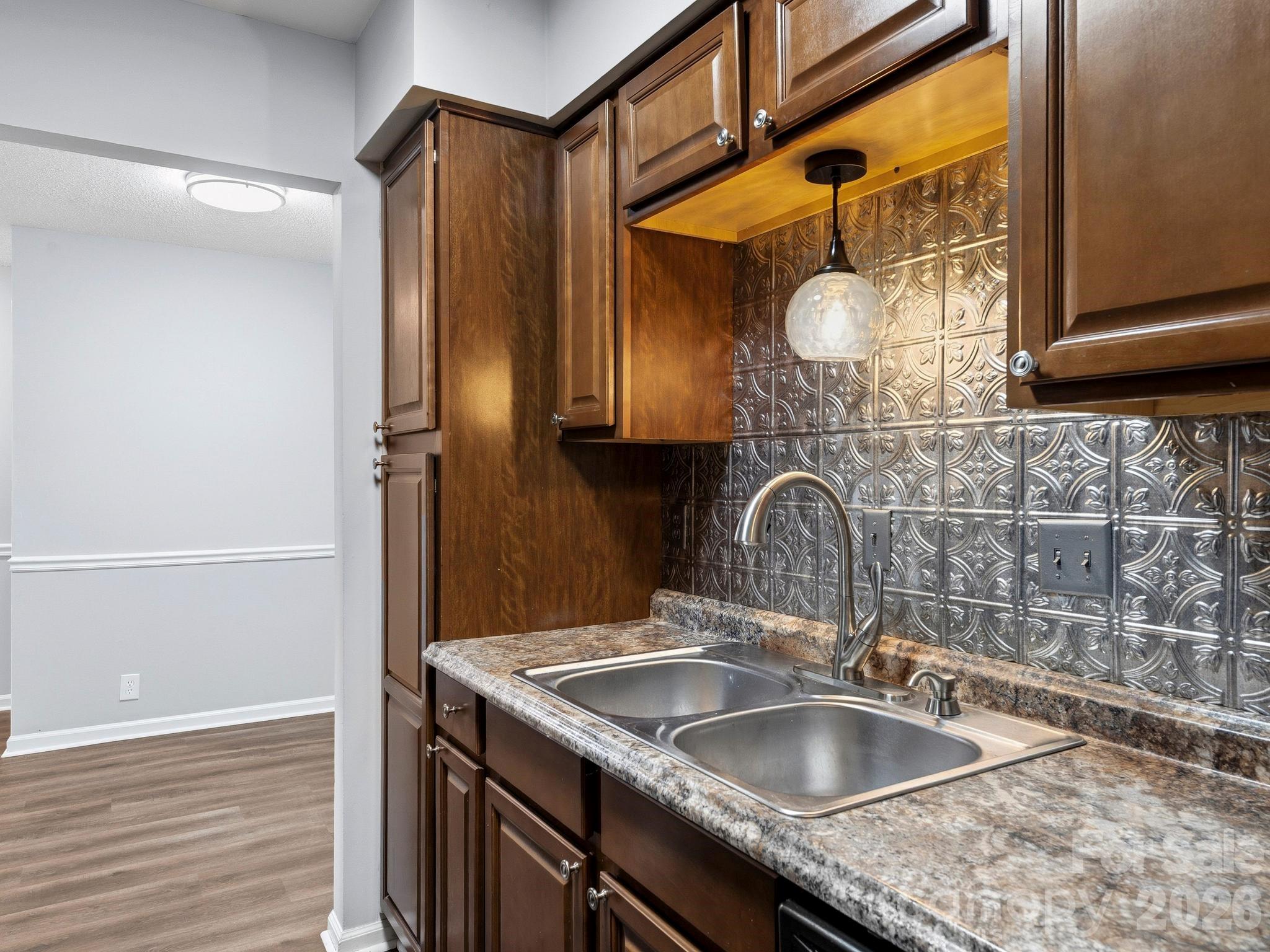 110 Heywood Road Arden, NC 28704 - Photo 7 of 22 a bathroom with a granite countertop sink and a mirror