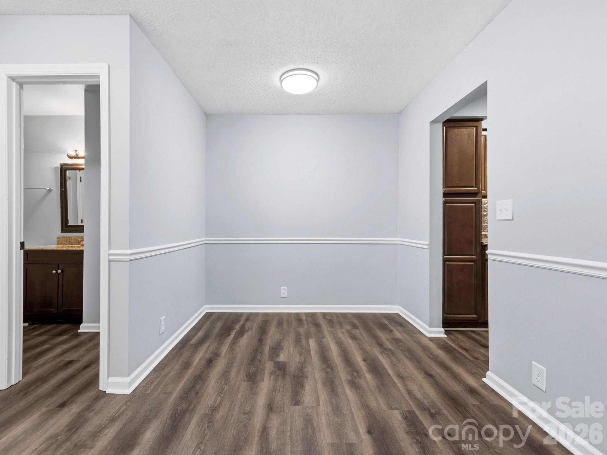 110 Heywood Road Arden, NC 28704 - Photo 10 of 22 wooden floor in an empty room
