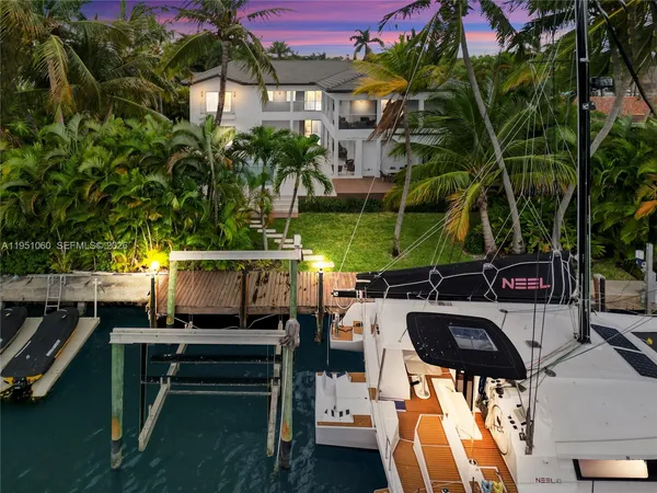 a bedroom with bed and a night stand