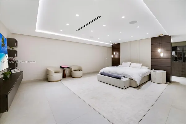 a view of a hallway with kitchen view and living room
