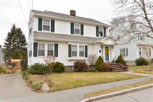 a front view of a house with lots of windows