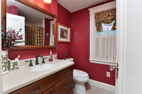 38 Jenness Street Quincy, MA 02169 - Photo 16 of 23 a bathroom with a sink a mirror and a toilet