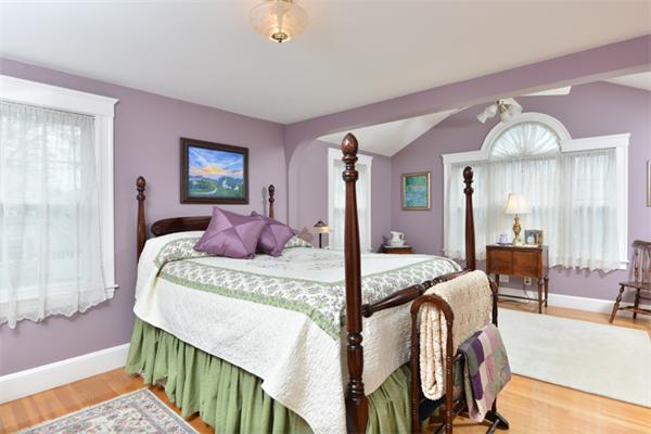 38 Jenness Street Quincy, MA 02169 - Photo 17 of 23 a bedroom with bed and wooden floor