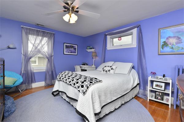 38 Jenness Street Quincy, MA 02169 - Photo 21 of 23 a bedroom with a bed and a chandelier