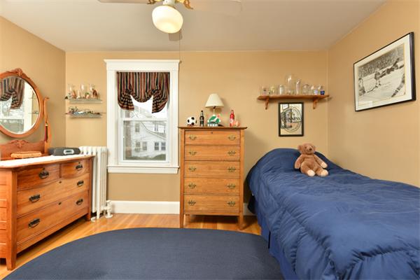 38 Jenness Street Quincy, MA 02169 - Photo 22 of 23 a bedroom with a bed and a dresser