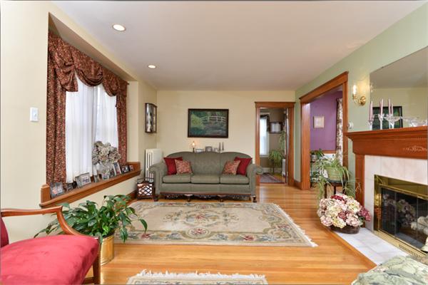 38 Jenness Street Quincy, MA 02169 - Photo 3 of 23 a living room with furniture and a fireplace