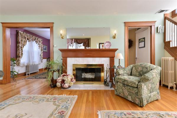 38 Jenness Street Quincy, MA 02169 - Photo 4 of 23 a living room with furniture and a fireplace