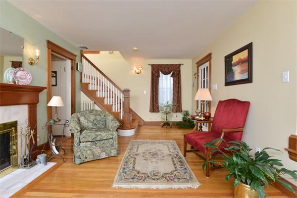 38 Jenness Street Quincy, MA 02169 - Photo 5 of 23 a living room with furniture windows and a fireplace
