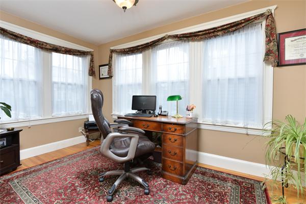 38 Jenness Street Quincy, MA 02169 - Photo 6 of 23 a view of a workspace with furniture and a window