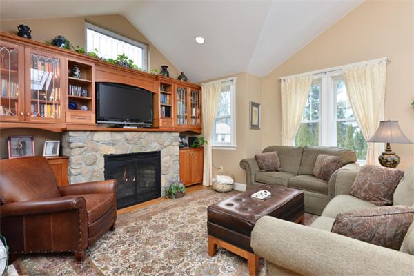 38 Jenness Street Quincy, MA 02169 - Photo 9 of 23 a living room with furniture a flat screen tv and a fireplace