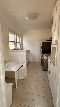 a view of living room with furniture and flat screen tv