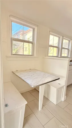 a white bath tub sitting next to a window
