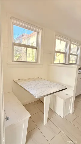 a white bath tub sitting next to a window