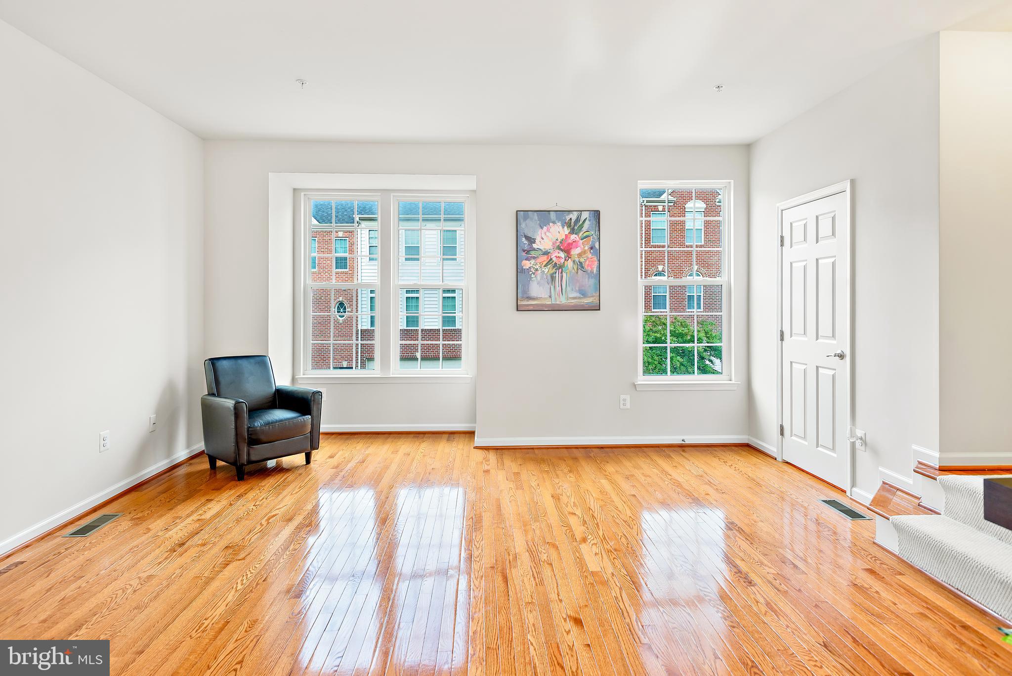 3838 Cullingworth Road Burtonsville, MD 20866 - Photo 42 of 69 a view of a room with a window and wooden floor