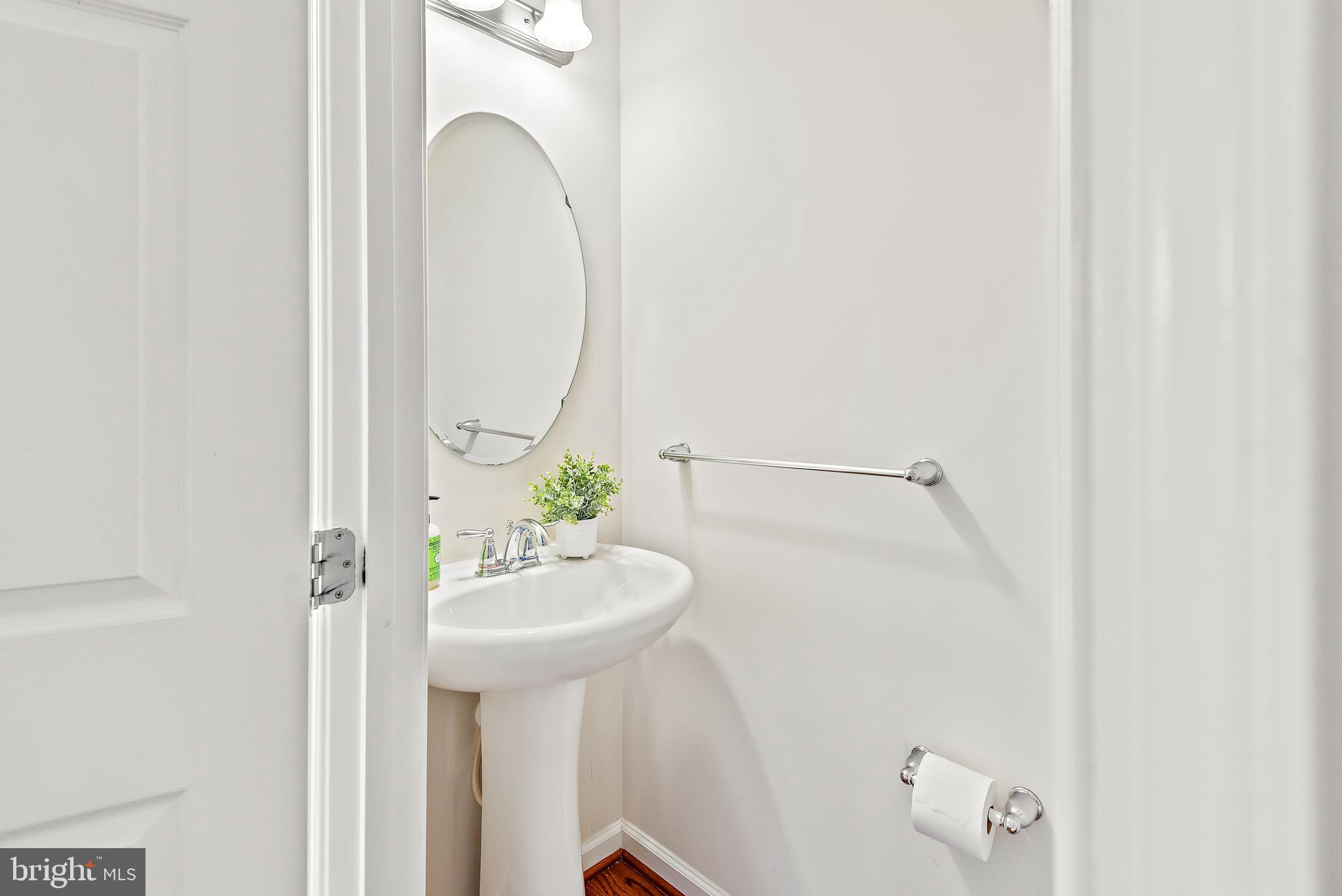 3838 Cullingworth Road Burtonsville, MD 20866 - Photo 47 of 69 a bathroom with a sink and a mirror