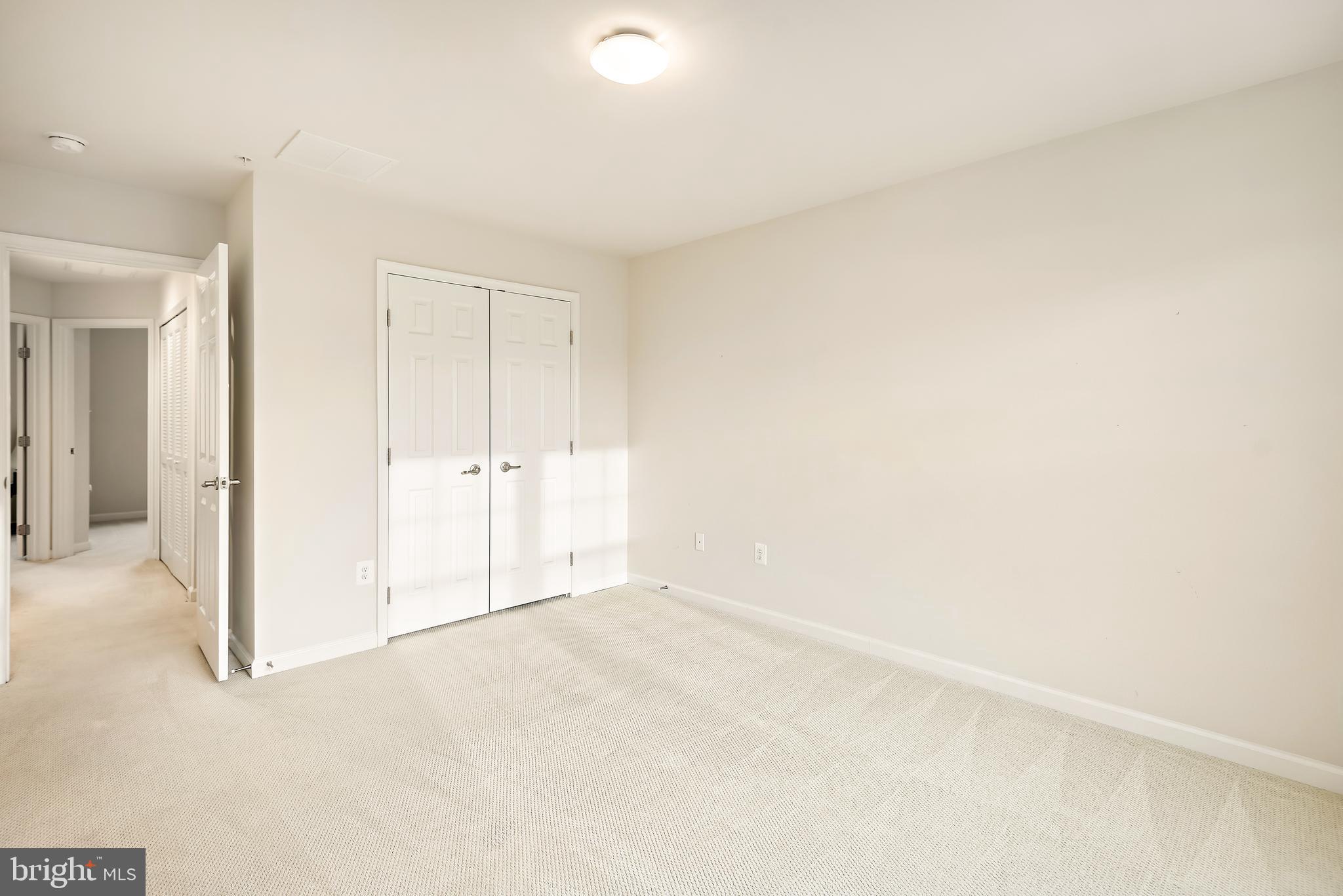 3838 Cullingworth Road Burtonsville, MD 20866 - Photo 59 of 69 an empty room with white wall and closet