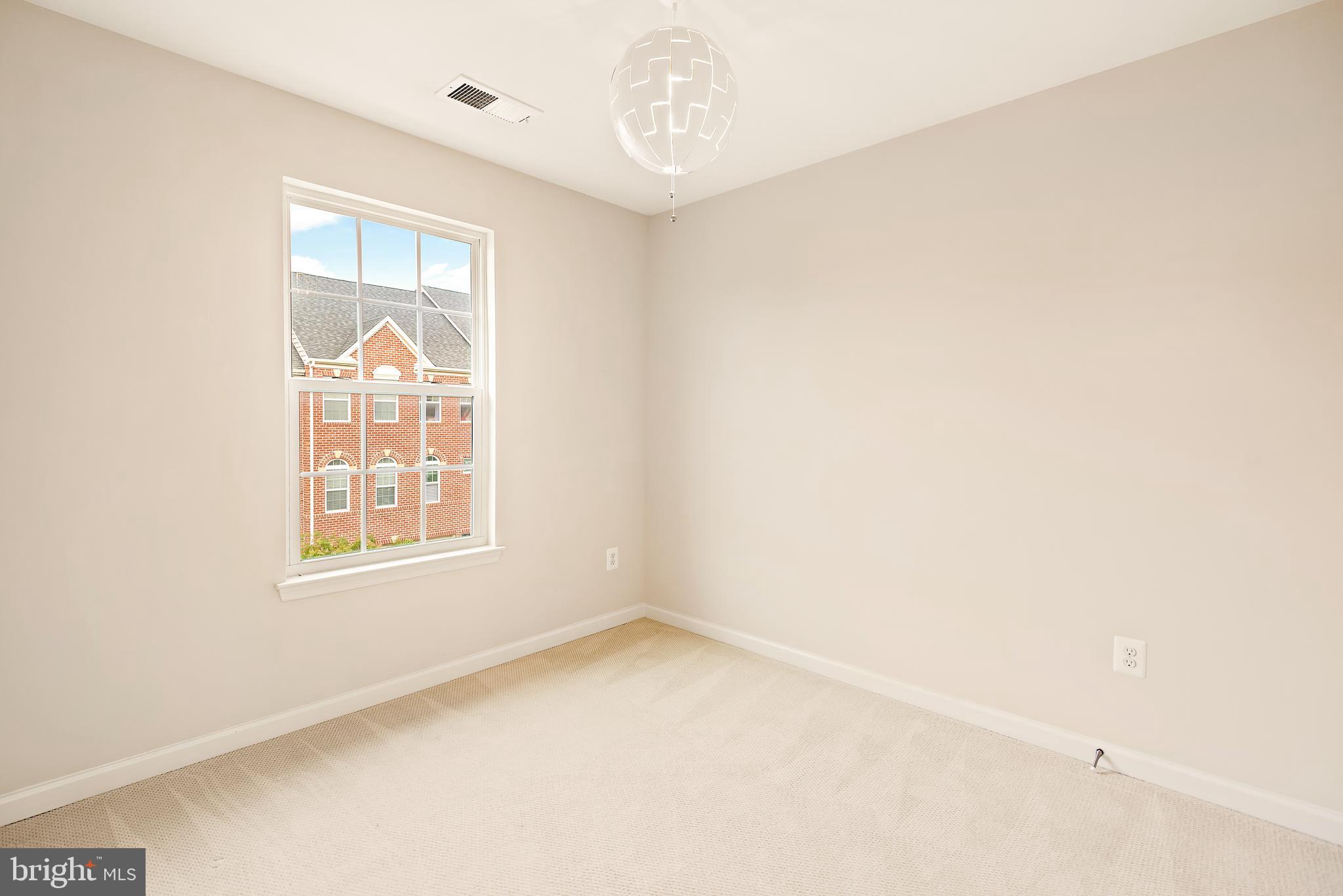 3838 Cullingworth Road Burtonsville, MD 20866 - Photo 66 of 69 an empty room with a window