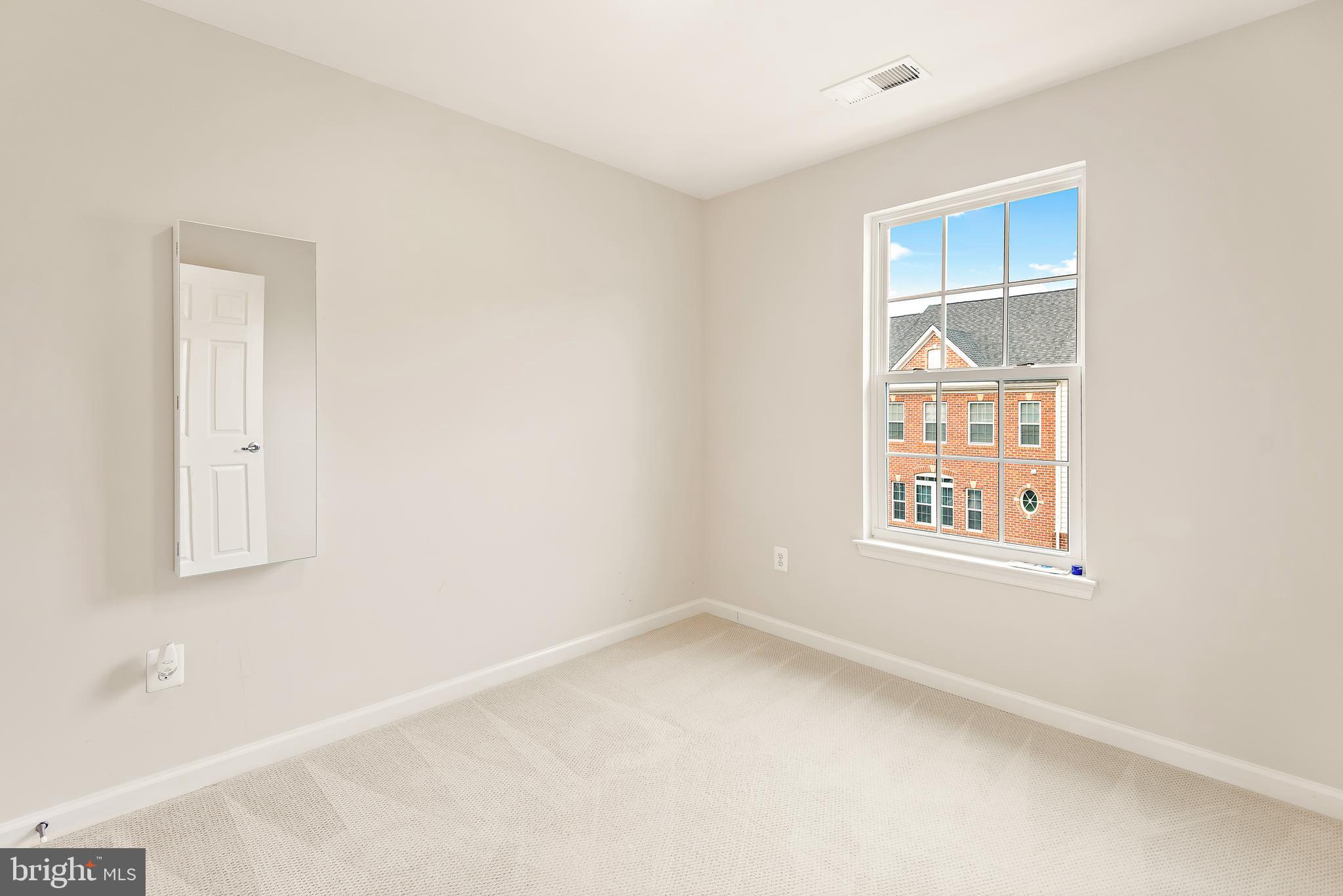 3838 Cullingworth Road Burtonsville, MD 20866 - Photo 67 of 69 an empty room with a window