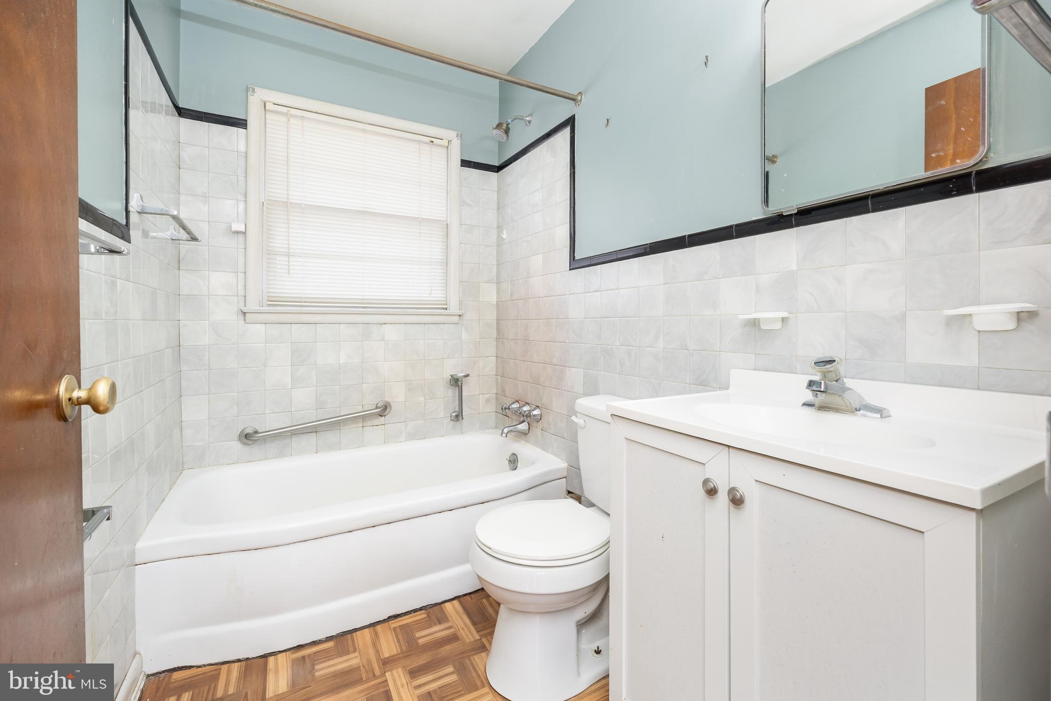 310 Zion Road Salisbury, MD 21804 - Photo 19 of 40 a bathroom with a sink a toilet and a bathtub