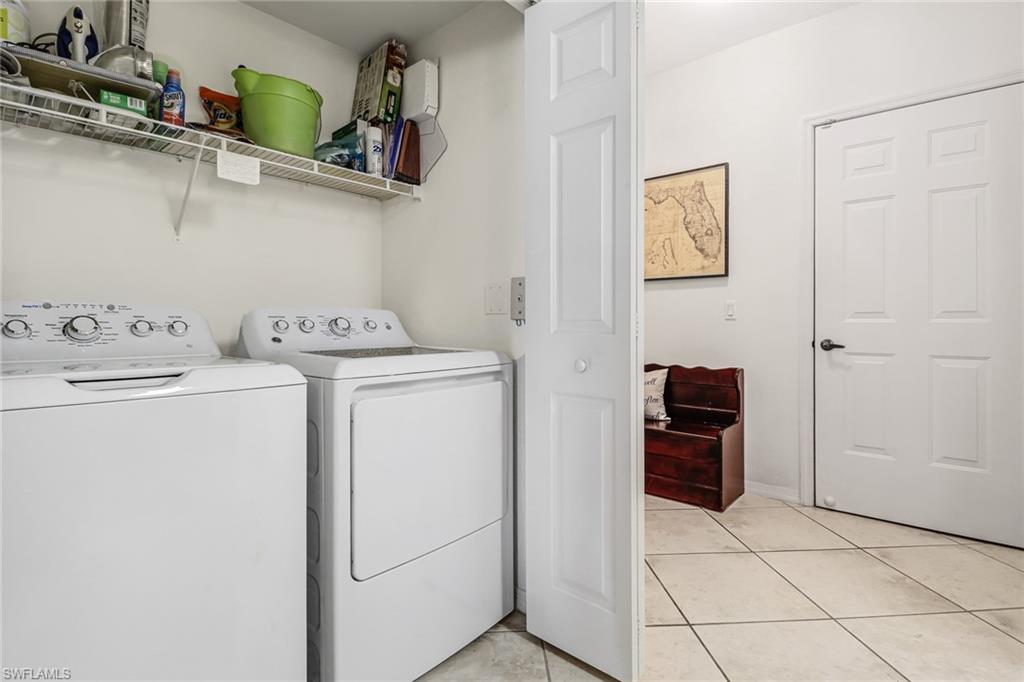 20301 Estero Gardens Circle, Unit 104 Estero, FL 33928 - Photo 13 of 43 a utility room with dryer and washer