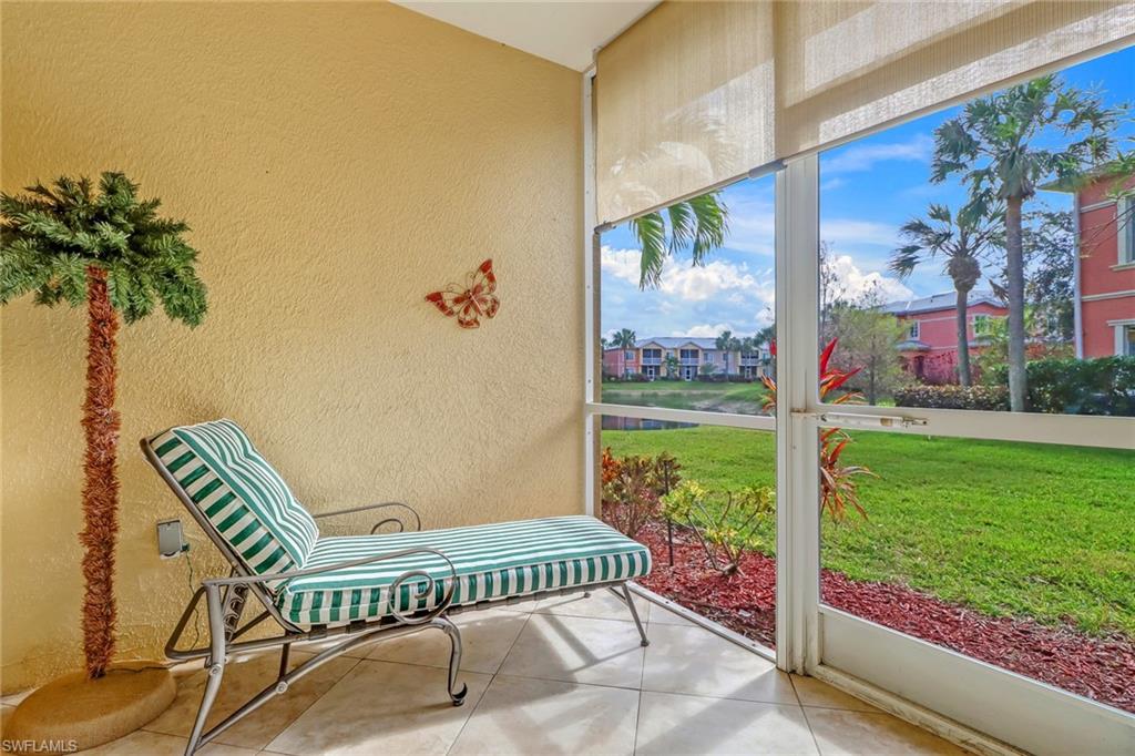 20301 Estero Gardens Circle, Unit 104 Estero, FL 33928 - Photo 22 of 43 a view of a chair and table in backyard of the house