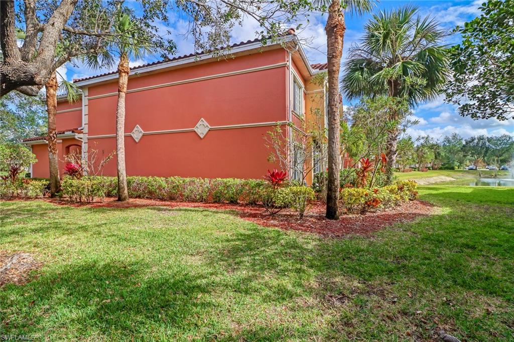 20301 Estero Gardens Circle, Unit 104 Estero, FL 33928 - Photo 23 of 43 a view of a back yard